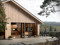 Modern villa vid kusten med svarta fönster och altandörr
